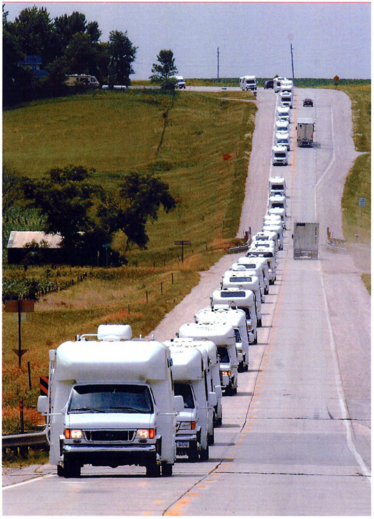 Caravan of Born Free motorcoaches traveling between the Fort Dodge, IA site of the Iowa Rally Before Homecoming to the Humboldt, IA site 20 miles north to the Born Free factory Homecoming Celebration