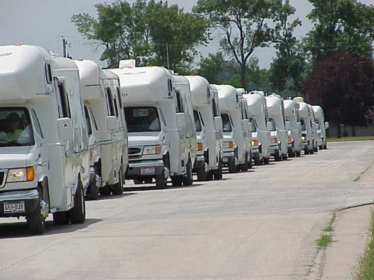 Lineup of Born Free motorcoaches for the caravan between Fort Dodge, IA and Humboldt, IA