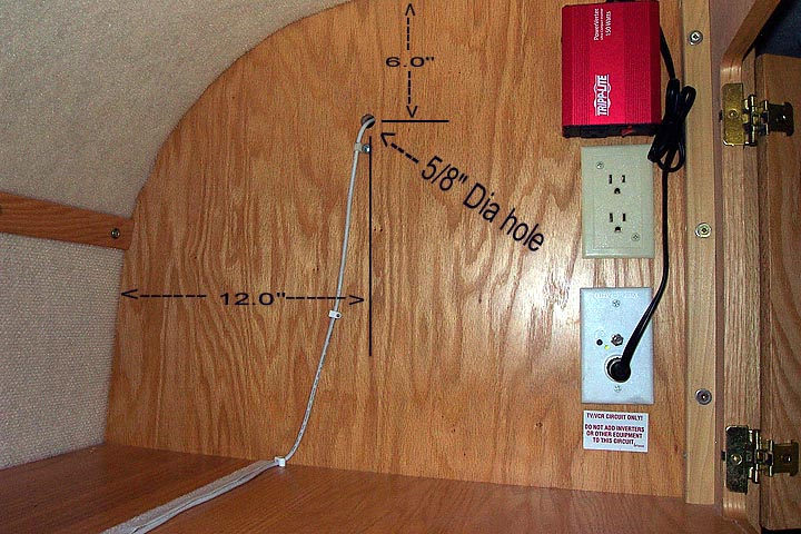Photo #6 - This photo shows the CapiFi USB Cable routing inside the upper cabinet located just to the left of the Norcold refrigerator. Seal the 5/8&amp;quot; diameter hole with builders clay to prevent gases from the refrigerator's propane burner leaking int