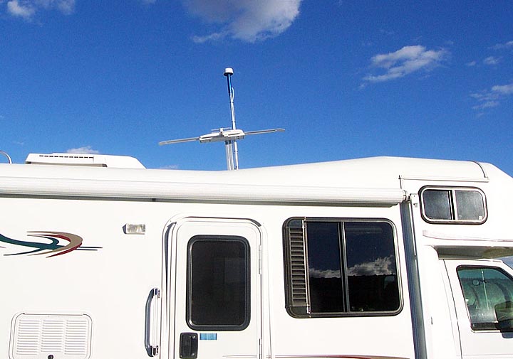 Photo #1 - This a view of the Winegard Batwing TV antenna and attached CapiFi WiFi antenna in the erected position above the coach.