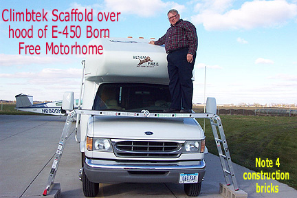 Photo of using ClimbTek Scaffold to reach top of cabover section on Born Free motorcoach
