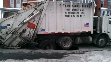 Pothole garbage truck.jpg