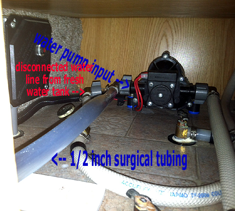 View of Fresh Water Tank Hose Disconnected from Water Pump Input and Winterization Hose Connected.jpg