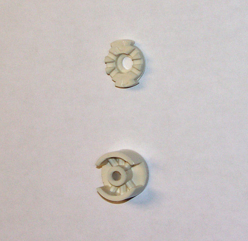Photo of new style beige plastic two-piece tensioner bobbin unassembled