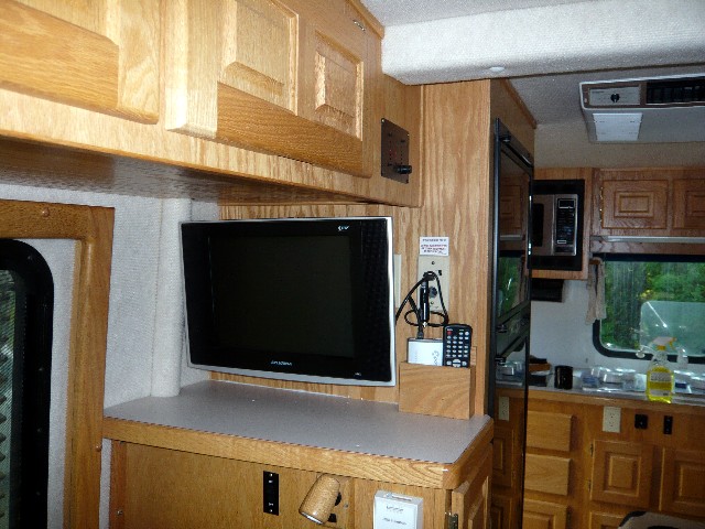 Finished installation, fully retracted arm, TV flush to wall.