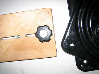Locking board retracted to allow table to swivel